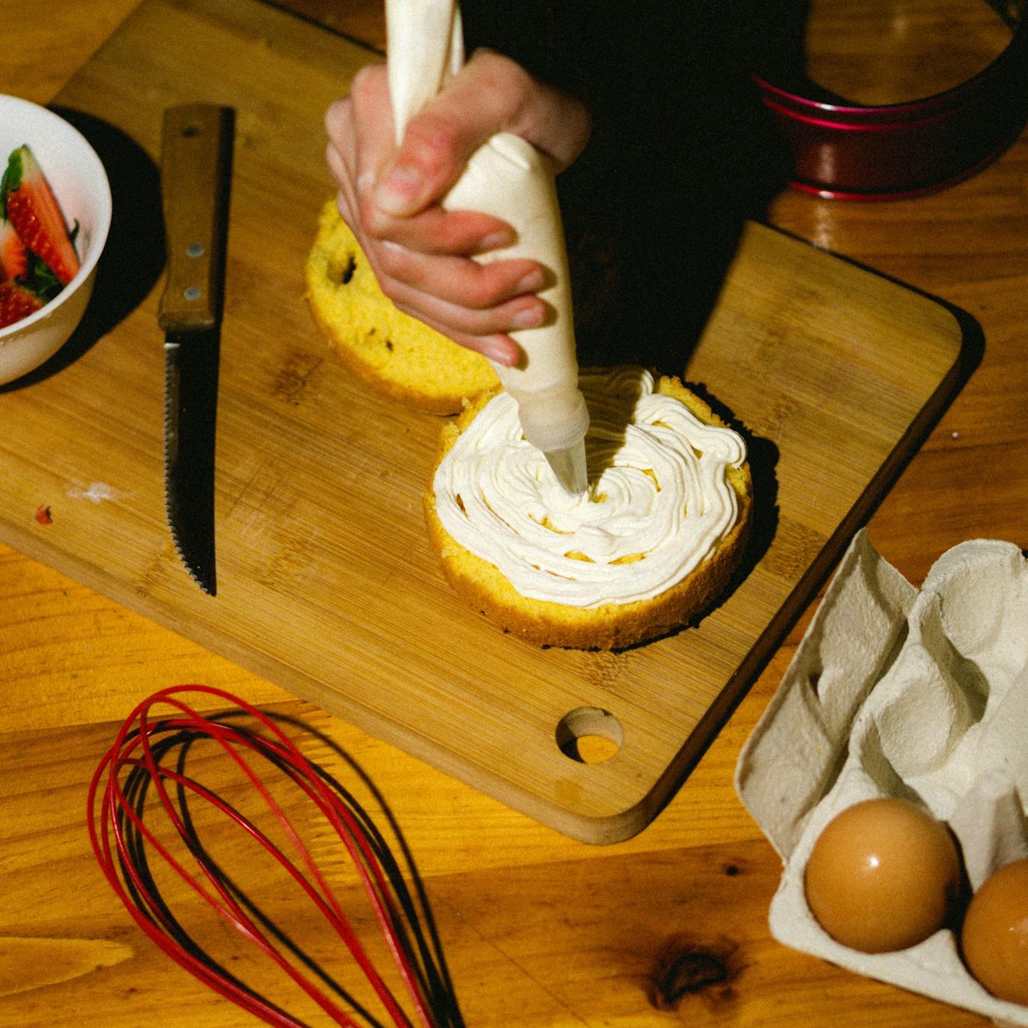 Diverse group of community members sharing a meal together, showcasing the social bonds formed through collaborative cooking